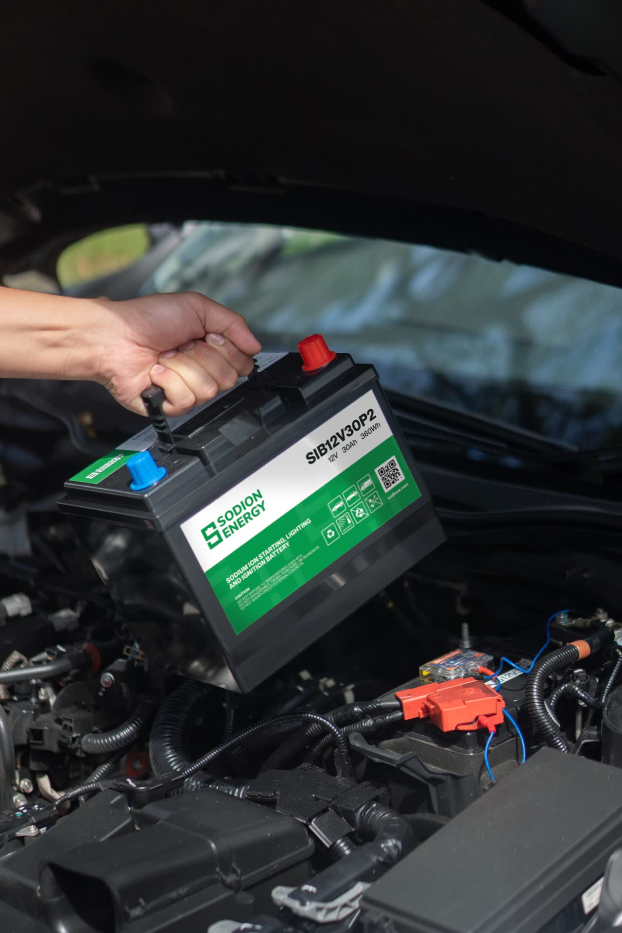 A Sodion Energy Prometheus II battery being fitted in an engine bay